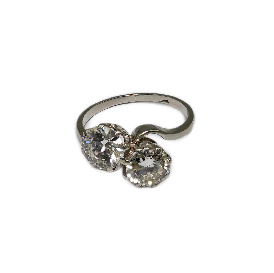 A platinum? and two stone diamond set crossover ring